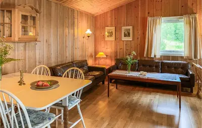 a living room with a couch and a table at 4 Bedroom Beach Front Home In Skodje in Skodje
