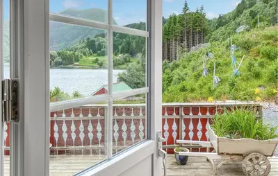 a window view of a lake from a house at Nice Home In Selje With Wifi in Stokke