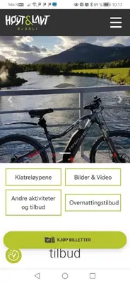a picture of a bike parked next to a river at Bøvervegen 19 Appartment nr 9 in Bjorli