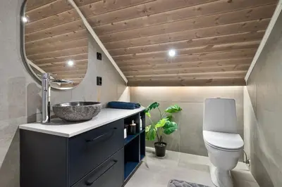 a bathroom with a sink and a toilet at Ski-in-out from the door Alpine XC Mountain views in Torvetjørn