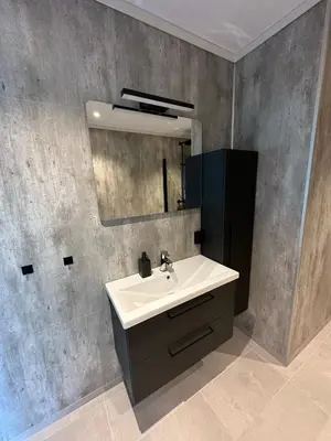 a bathroom with a sink and a mirror at Loen Panorama in Stryn
