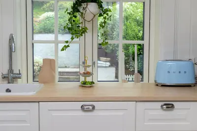 a kitchen counter with a sink and a window at Vakker leilighet - stor parkeringsplass 10min fra Bergen in Bergen