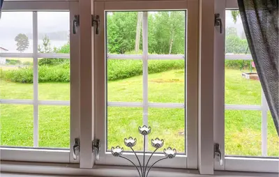 a window with a view of a field of grass at Nice Home In Sagstua With Lake View in Linstad