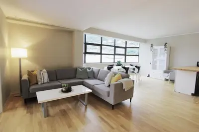 a living room with a couch and a table at Beautiful apartment with 3 bedrooms in Sogndal