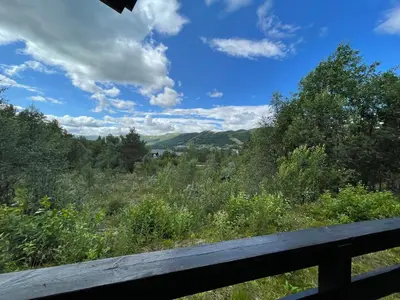 a view of the mountains from a wooden bench at Baybu - cabin close Geilo Skisenter and the center of Geilo in Geilo