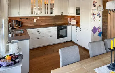 a kitchen with white cabinets and a counter top at 5 Bedroom Gorgeous Home In Sjusjøen in Sjusjøen