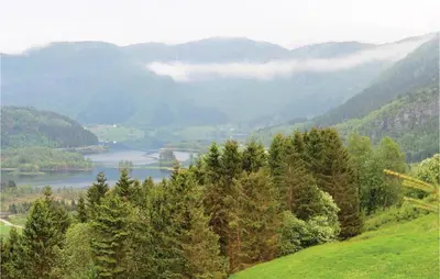 a view of a valley with a river and mountains at Amazing Home In Dale I Sunnfjord in Gjølanger