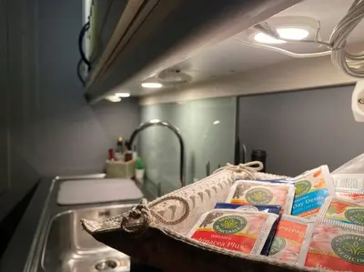 a sink in a kitchen with a sink at Cosy and well-equipped apartment with free parking in Trondheim