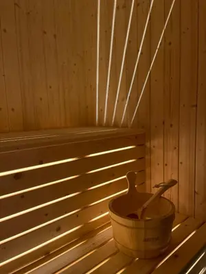 a wooden tub sitting in the inside of a sauna at Sogndal Chalet in Sogndal