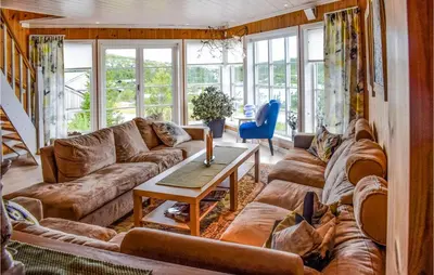 a living room with a couch and a table at Amazing Home In Eggedal With Kitchen in Eggedal