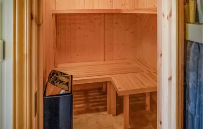 a wooden sauna with a bench in a room at Amazing Home In Eggedal With Kitchen in Eggedal