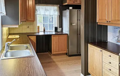 a kitchen with a sink and a refrigerator at Amazing Home In Eggedal With Kitchen in Eggedal