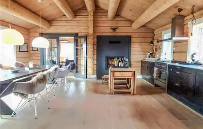 a kitchen and dining room with a table and chairs at 5 Bedroom Gorgeous Home In Tynset in Tynset