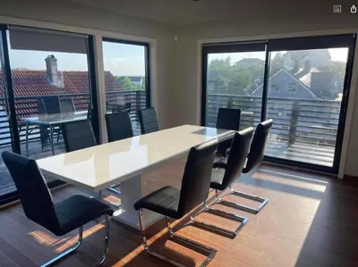a conference room with a large table and chairs at Nautnes Seaside Villa in Nautnes
