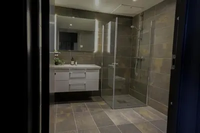 a bathroom with a shower and a sink at Elegant apartment in Trysil Alpine Lodge in Trysil