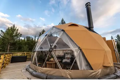 a large tent sitting on a wooden deck at Arctic Dome Gudbrandsdalen in Sør-Fron