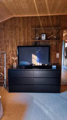 a large flat screen tv sitting in a living room at Skurdalsvegen 37L in Geilo