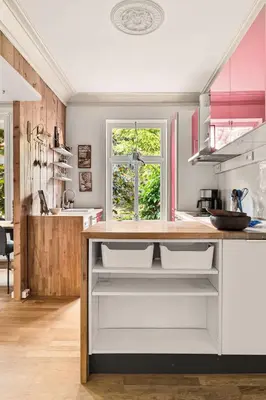 a kitchen with a wooden counter top in a room at Dinbnb Apartments I Characteristic Townhouse with Bathtub in Bergen