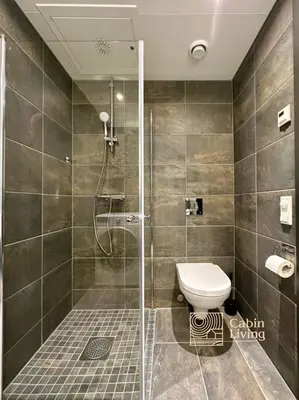 a bathroom with a shower and a toilet in it at New high standard apartment in Trysil with ski in out in Trysil