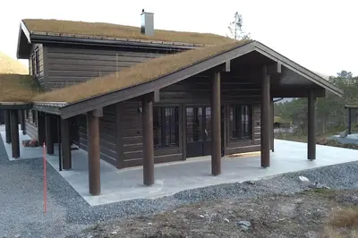 a small log cabin with a grass roof at Stor og koselig hytte i Stryn in Stryn