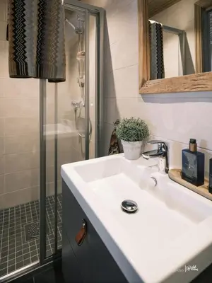 a bathroom with a white sink and a shower at Beautiful apartment - high standard - Geilo centre in Geilo