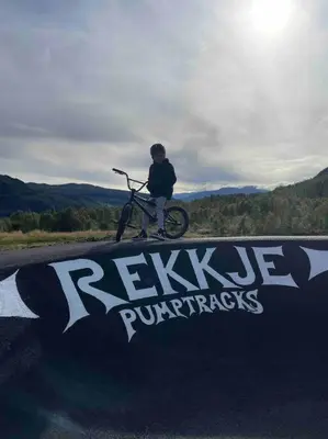 a person riding a bike on a skate ramp at Rindabotn Fjelltun ski in-ski out in Sogndal