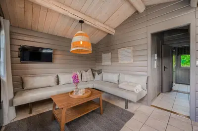 a living room with a couch and a table at Lillehammer Turistsenter Camping in Lillehammer