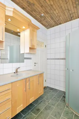 a kitchen with a sink and a refrigerator at Elton Hotel in Raufoss