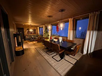 a dining room with a table and chairs in a room at Hafjell Front 220D 8pers, Ski inout , Downhill Bike in Hafjell