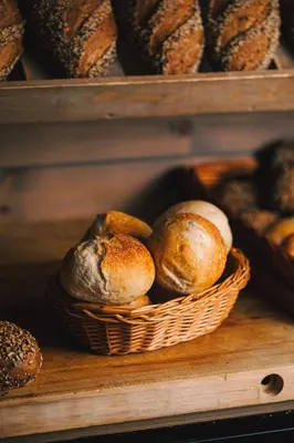 a bunch of breads in a basket on a shelf at Highland Lodge Fjellandsby in Geilo