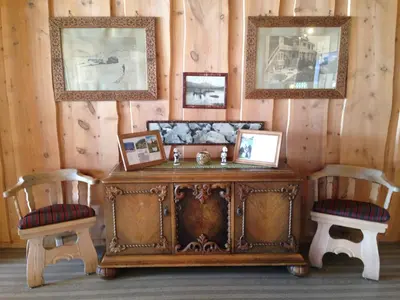a room with a wooden table and two chairs at Bessheim Fjellstue og Hytter in Bessheim