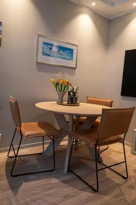 a dining room with a table and chairs at Leilighet Damsgård , nær sentrum in Bergen