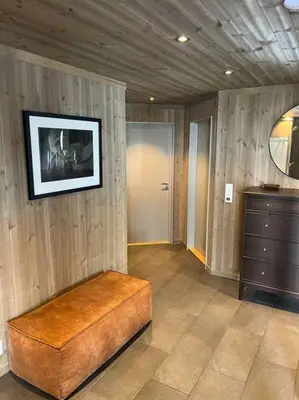 a room with a couch and a picture on the wall at Hovdetunet 77-Gaustablikk in Gaustablikk