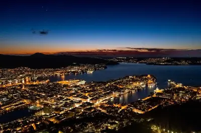 an aerial view of a city at night at Central Seafront Apartments with Parking and Self Check-In! in Bergen