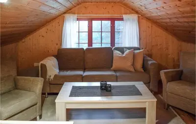 a living room with a couch and a table at 3 Bedroom Stunning Home In Rjukan in Gaustablikk