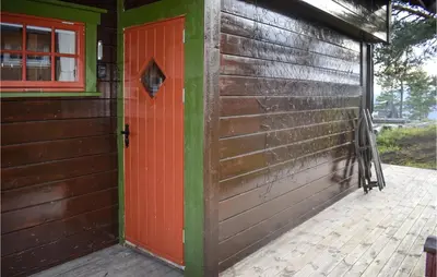 a red door on the side of a building at 3 Bedroom Stunning Home In Rjukan in Gaustablikk