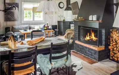a kitchen and living room with a fireplace at 3 Bedroom Nice Home In Gol in Gol