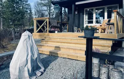 a house with a wooden deck with a bag next to it at 3 Bedroom Nice Home In Gol in Gol