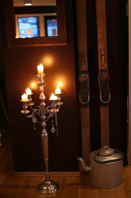 a chandelier with candles in a room at Hordatun Apartments in Røldal