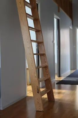 a wooden ladder leaning against a wall in a room at Hordatun Apartments in Røldal
