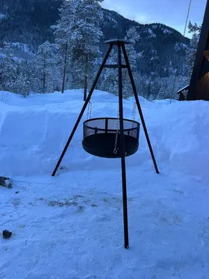a swing set in the snow with snow at Storekleiv Hyttefelt Tuddal in Tuddal
