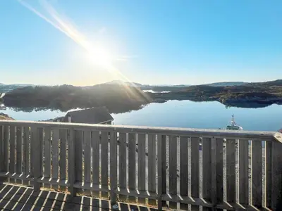 a view from the deck of a house overlooking a lake at 6 person holiday home in bremnes-By Traum in Bremnes