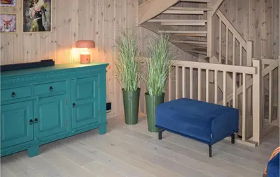 a blue cabinet and a blue stool in a room at Cozy Home In Rauland With Sauna in Torvetjørn