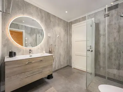 a bathroom with a sink and a mirror at Holiday Home Mathias by Interhome in Vik