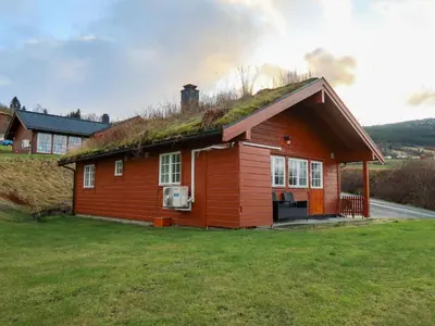 a small red house with a grass roof at Chalet Hagehytta by Interhome in Utvik