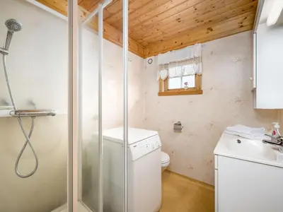 a small bathroom with a toilet and a sink at Chalet Hagehytta by Interhome in Utvik