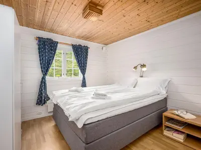 a bedroom with a large bed in a room at Chalet Hagehytta by Interhome in Utvik