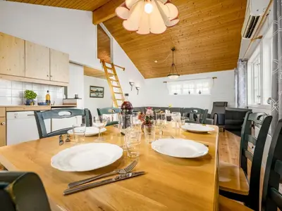 a dining room table with white plates and silverware at Chalet Hagehytta by Interhome in Utvik