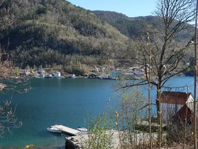 a view of a lake with boats in the water at Holiday Home Villa Hjartnes by Interhome in Hjartåker