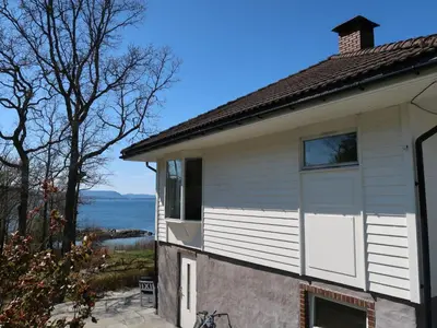 a house with the view of the ocean at Holiday Home Villa Hjartnes by Interhome in Hjartåker